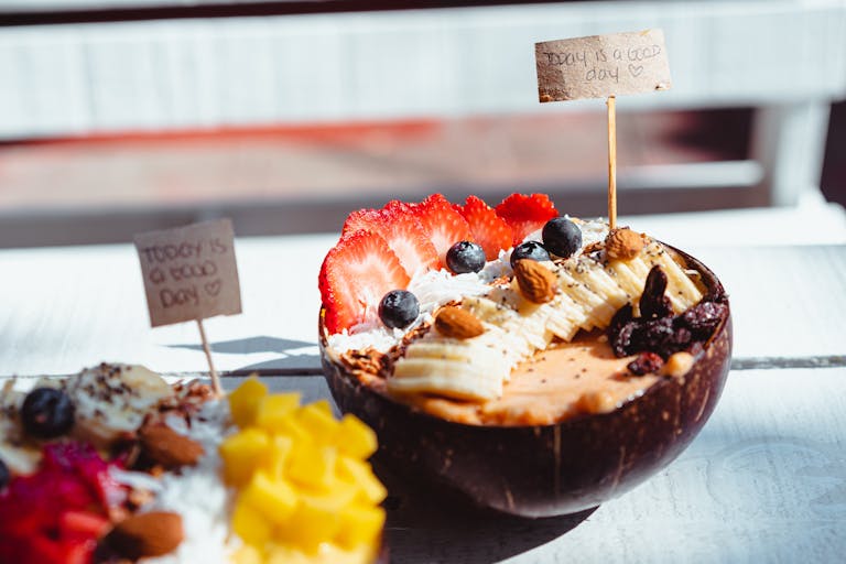 Close-up of a vibrant acai bowl topped with fresh fruits and nuts, perfect for a healthy breakfast.