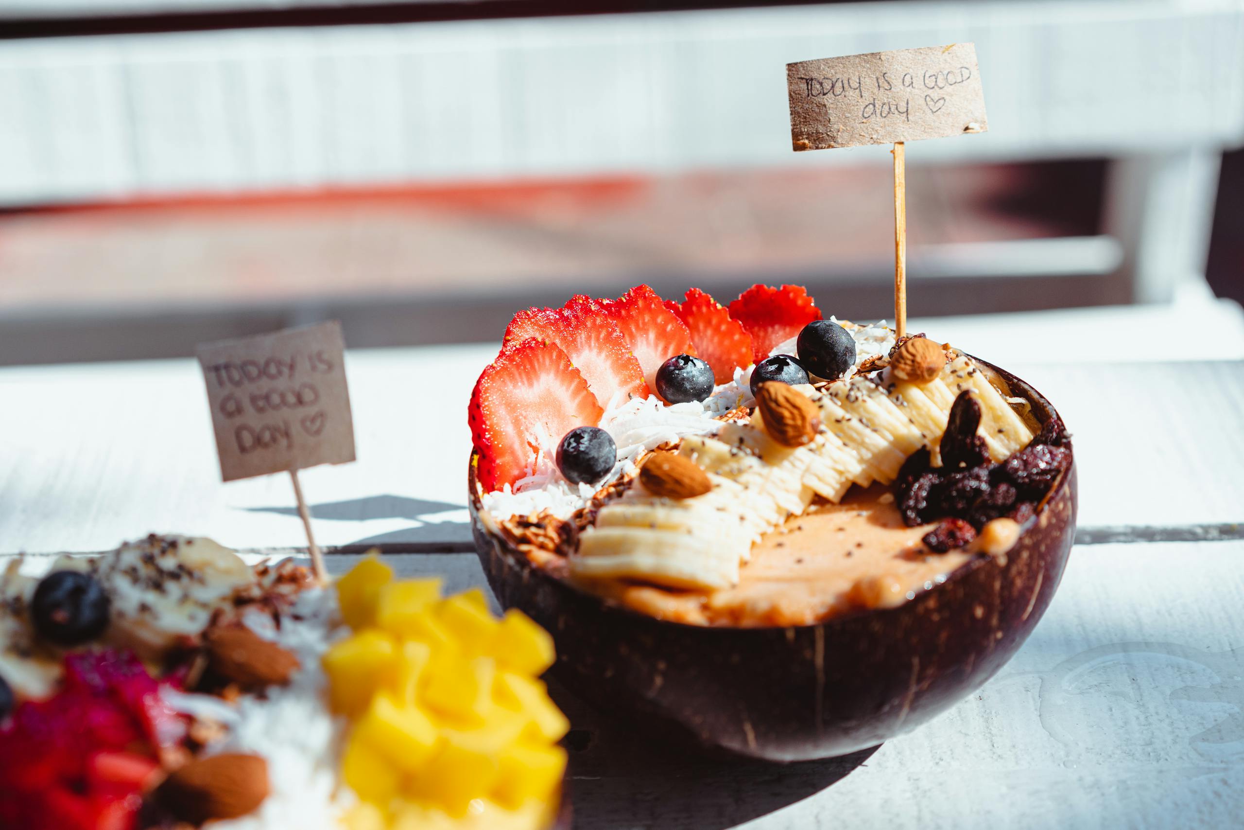 Close-up of a vibrant acai bowl topped with fresh fruits and nuts, perfect for a healthy breakfast.